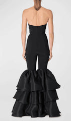 BLACK STRAPLESS JUMPSUIT WITH TIERED RUFFLE HEM