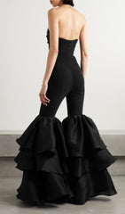 BLACK STRAPLESS JUMPSUIT WITH TIERED RUFFLE HEM